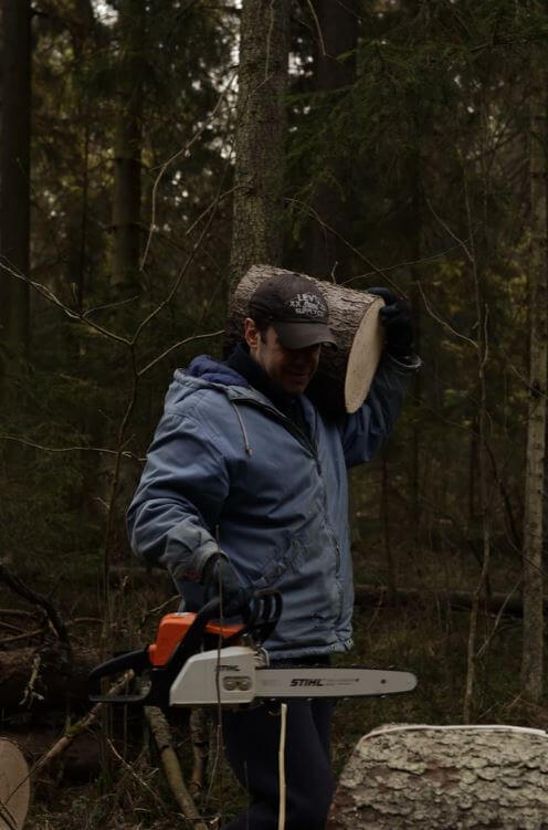 man carrying stump